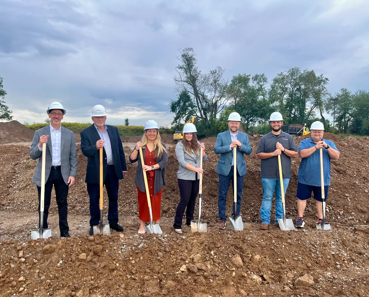 Alliance Family Health Center representatives celebrate the groundbreaking of the new Hartville campus in Ohio, wearing hard hats and holding shovels.